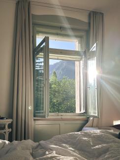 morning light, hotel room, sun shining through the window in a swiss historic hotel