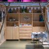 My exhibition stand at the Trau dich Messe 2025, cosy wooden frame with pictures and examples, string of lights,