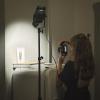 my assistant, taking photos of the artworks, studio set up in a hotel room, aesthetic photos